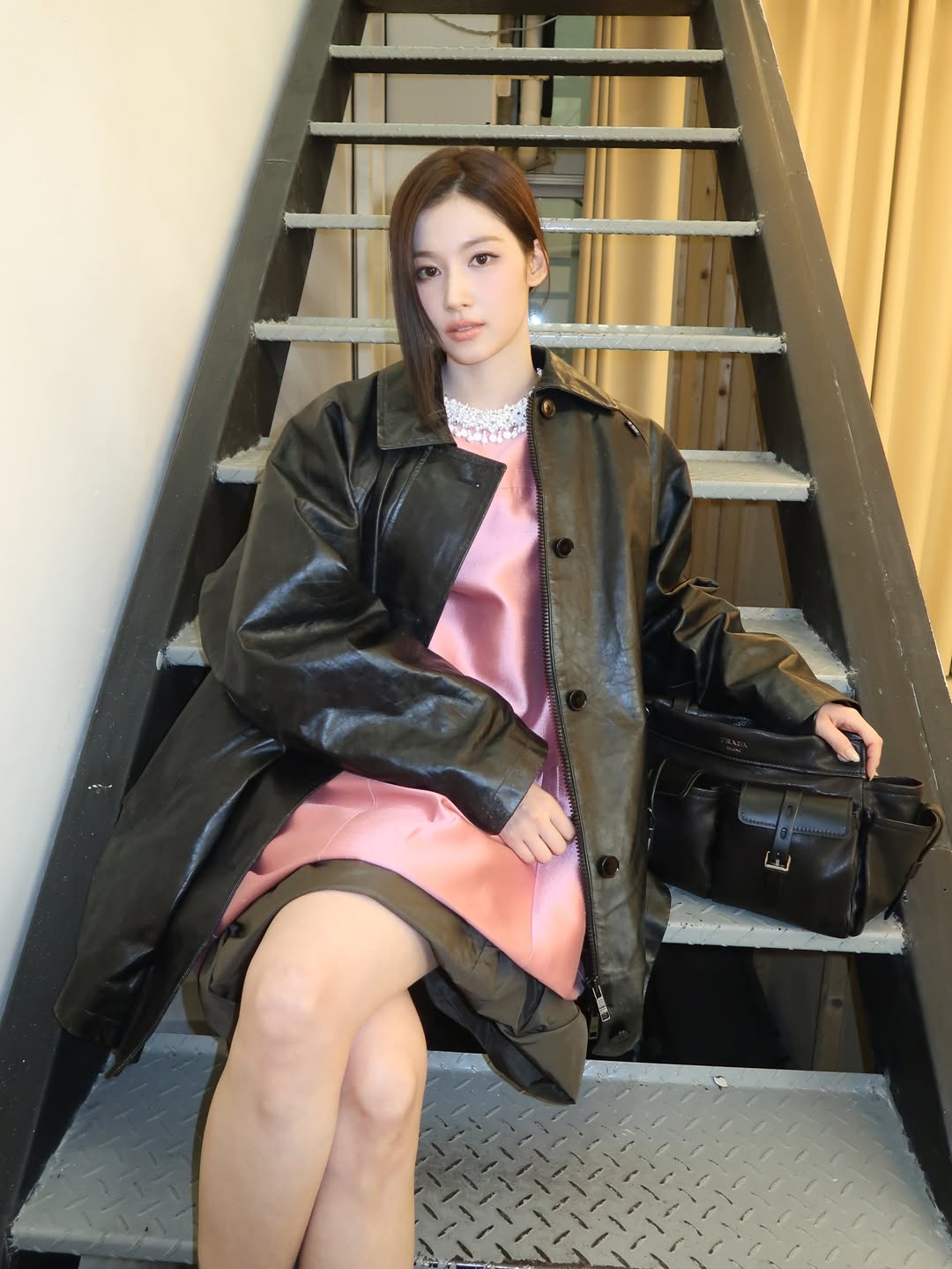 Sana performing with TWICE during a live stage, highlighting her role as a vocalist and performer in one of K-pop’s globally recognized girl groups.