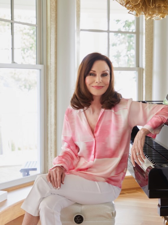 Lorie Line performing live on tour, showcasing her signature piano style and engaging stage presence that has captivated audiences across the United States for over three decades.